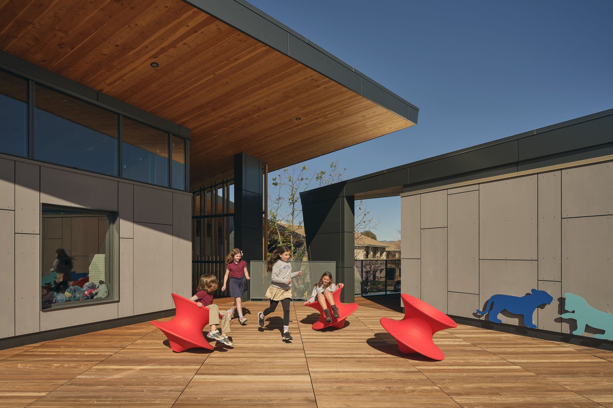 kids playing on a balcony at school