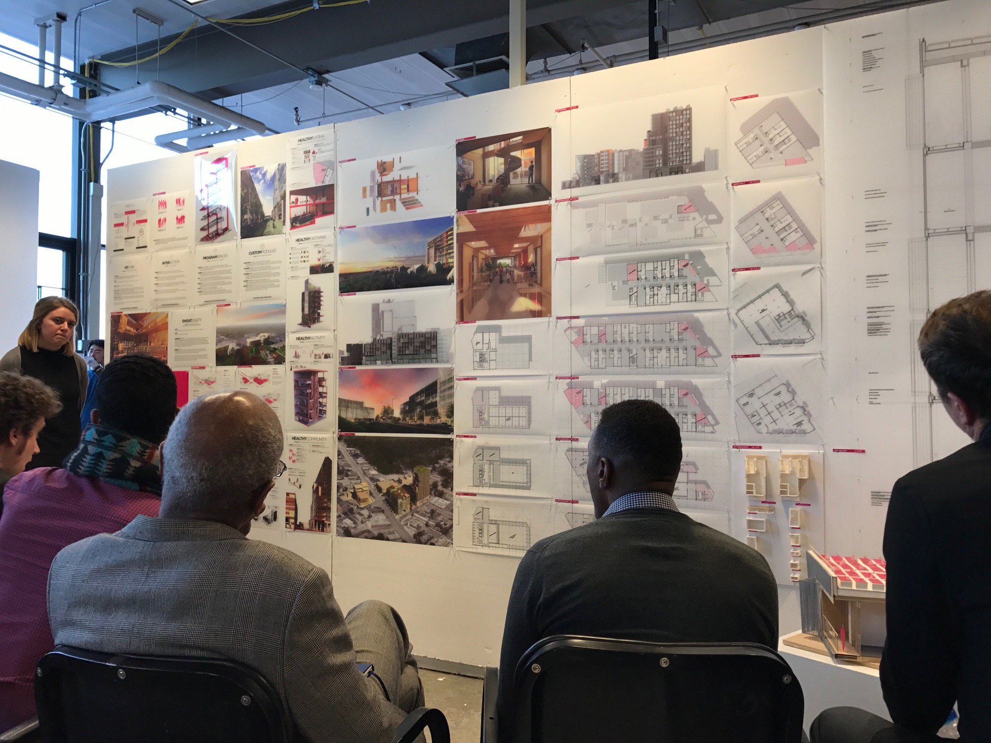 images of architecture students during a review